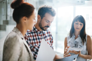 Business people discussing movingimage SharePoint Connector